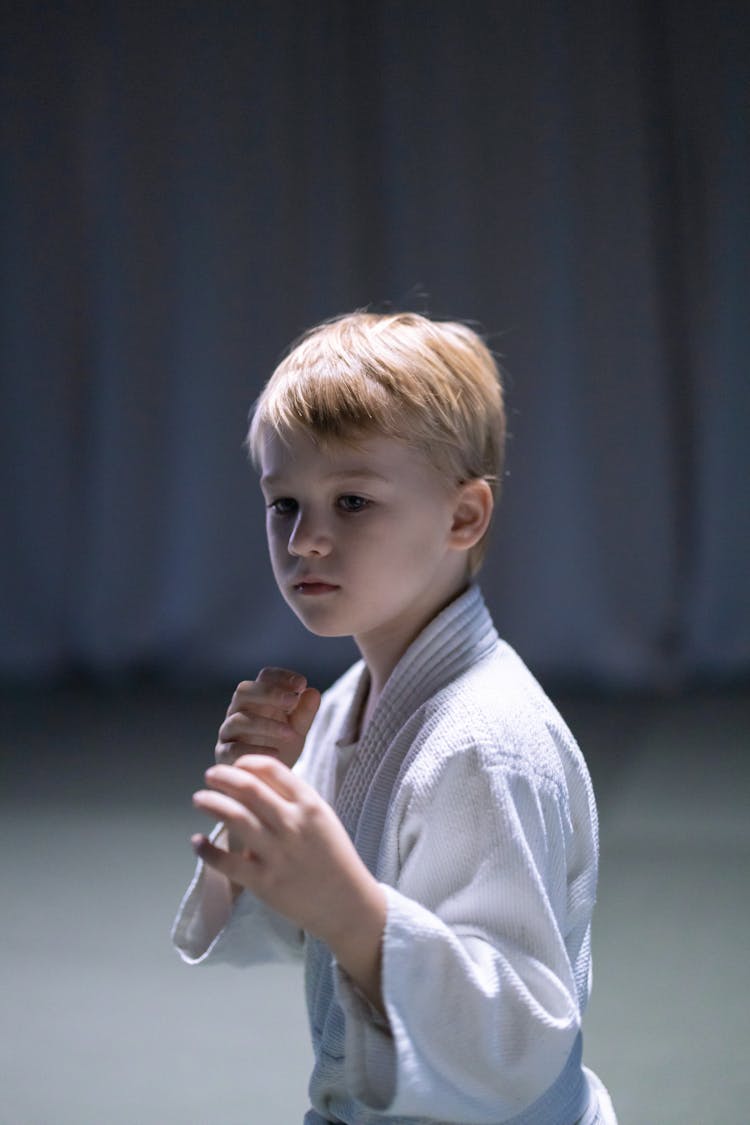 A Boy Wearing White Karate Gi