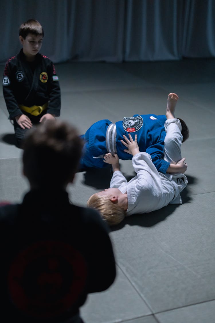 Boys Sparring On Black Mat