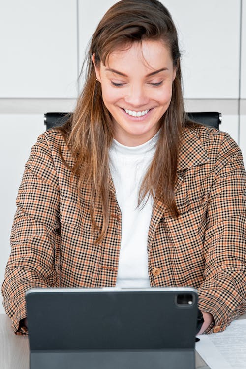 Happy Woman Using a Tablet