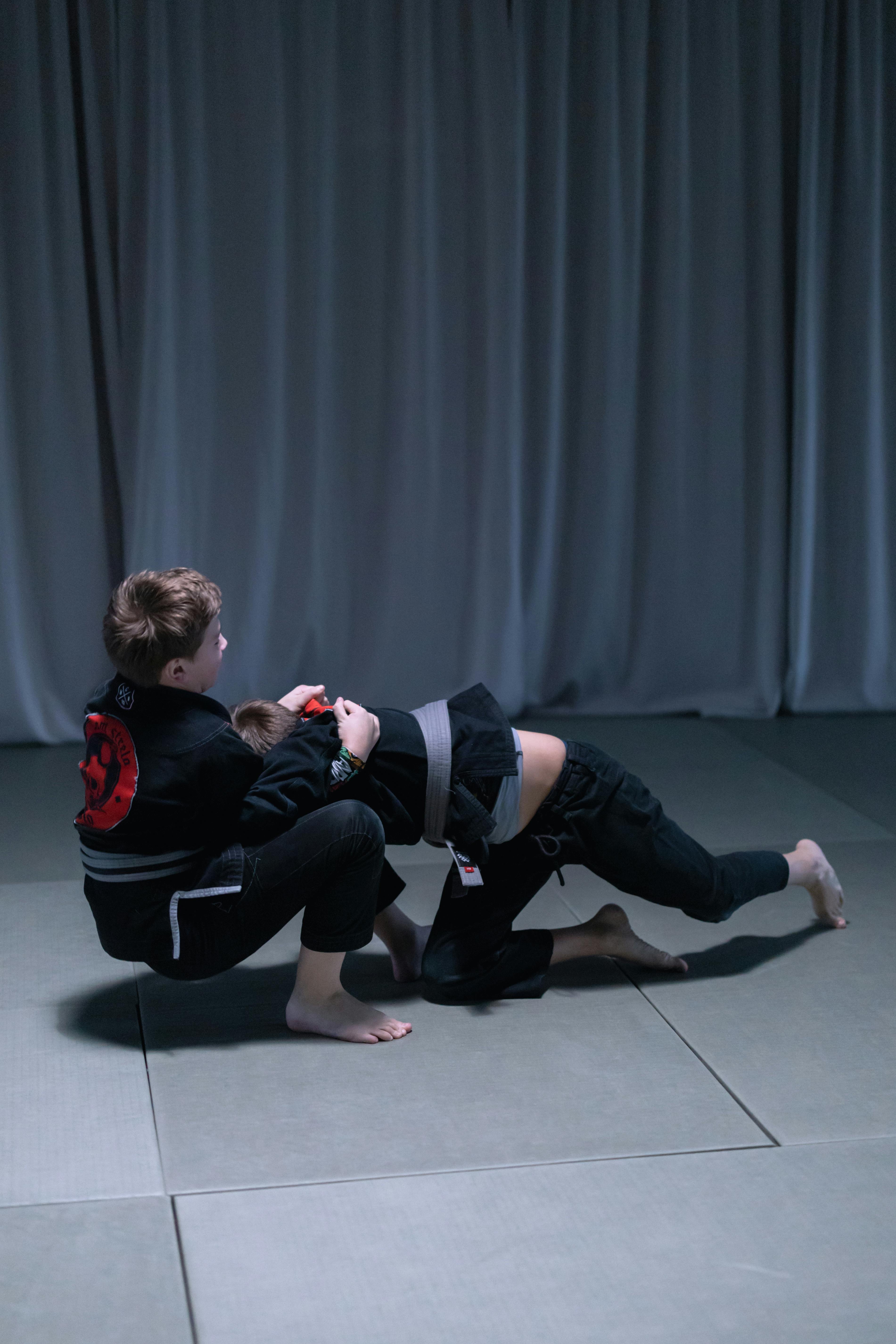 boys practicing jiu jitsu