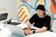 Man Using Electronics at Office Work