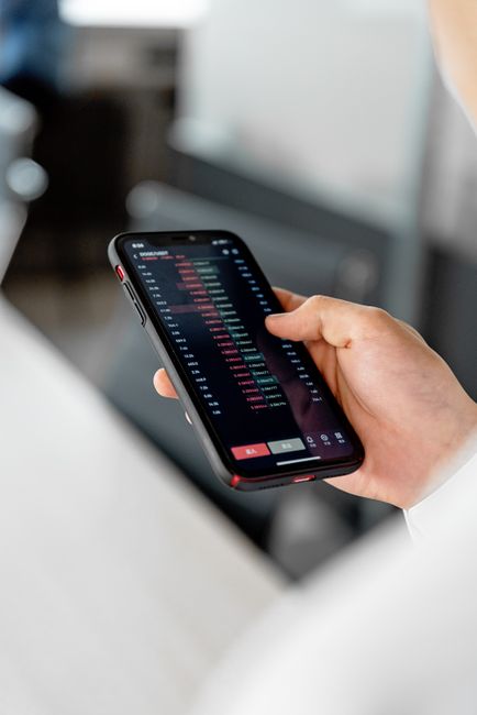 person checking stock portfolio on phone