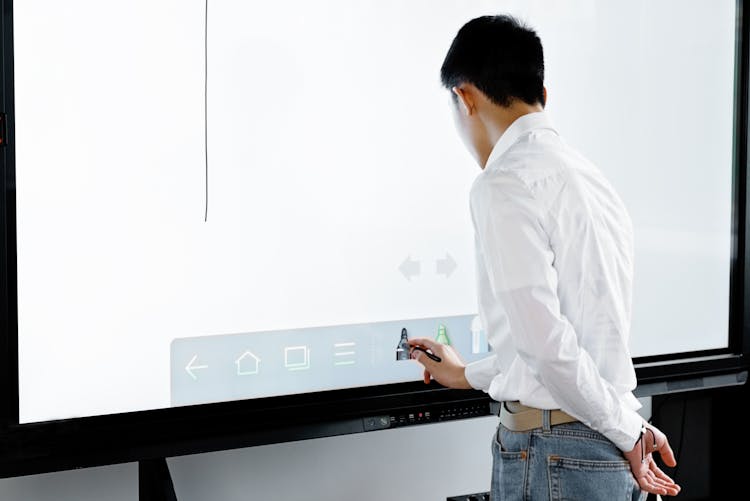 A Person Using An Interactive Whiteboard