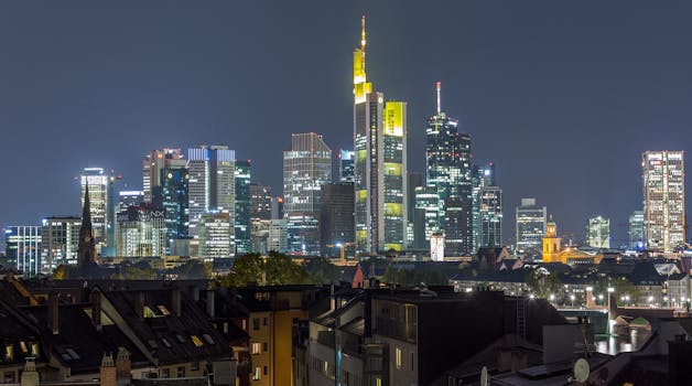 Stunning Frankfurt skyline shining brightly at night, showcasing modern architecture.