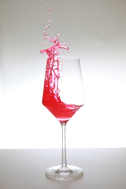 Clear Wine Glass with Red Liquid