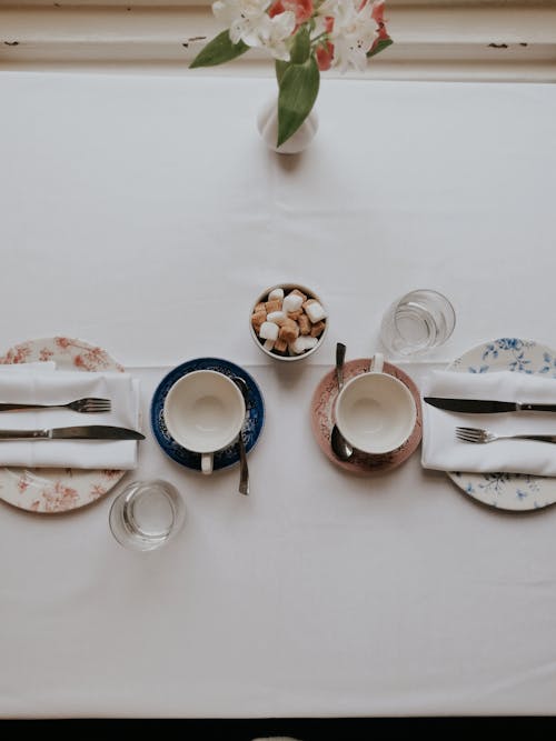 Free Top View Shot of a Table Setting on a White Surface Stock Photo