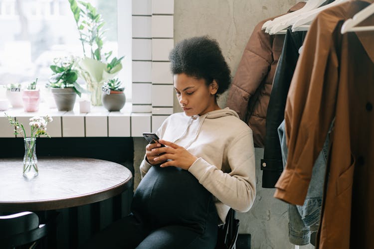 Pretty Woman Texting On A Smartphone