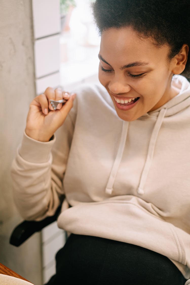 Smiling Woman Holding A Fork