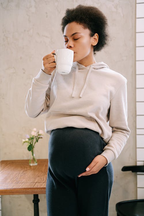 A Pregnant Woman Drinking