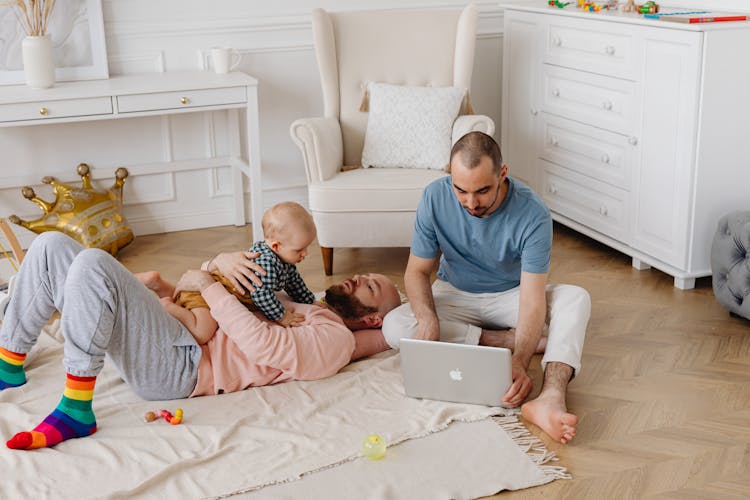 A Family Staying On The Living Room 