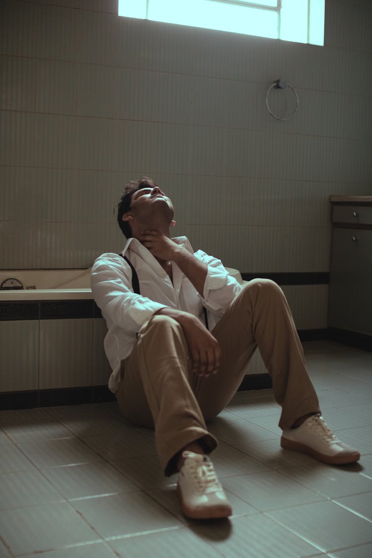 Melancholic Man Sitting Near Bathtub