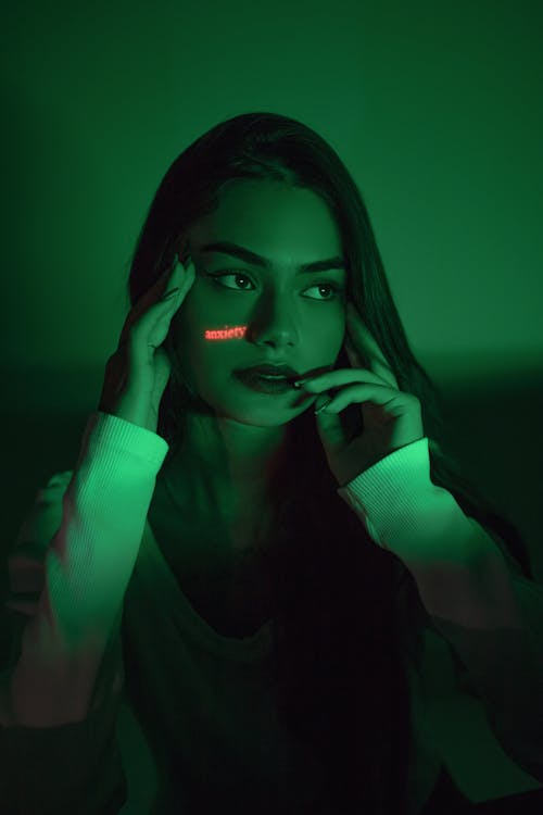Dreamy woman with glowing light on face