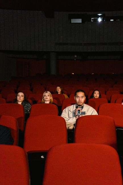 moviegoers watching film in cinema hall