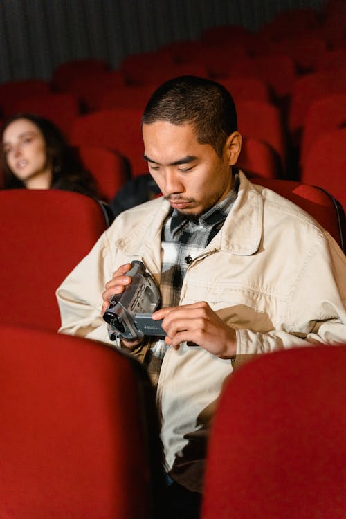 Man Holding a Video Recorder