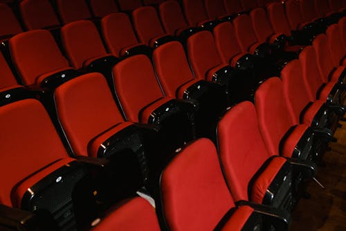 Free Red and Black Vacant Seats in Cinema Theater Stock Photo