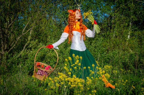 A Woman in Colorful Costume in a Flower Field