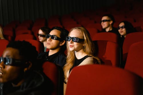 A Woman Wearing Viewing Glasses in a Cinema