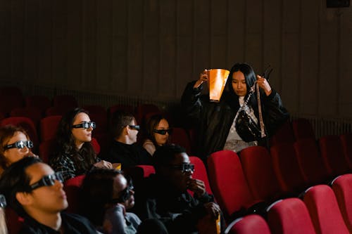 A Woman Going to Her Seat in the Cinema