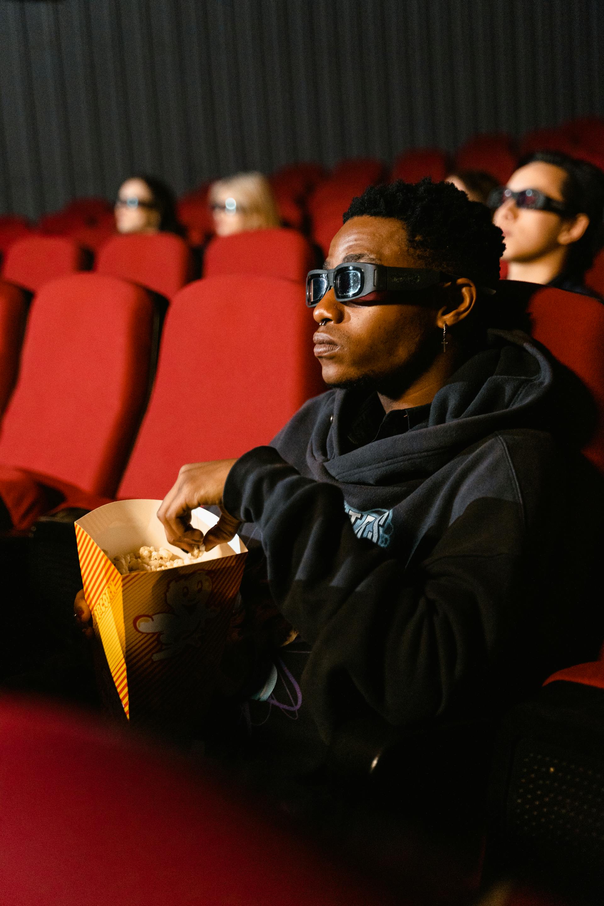 Close-up of a golden film award trophy on a dark background
