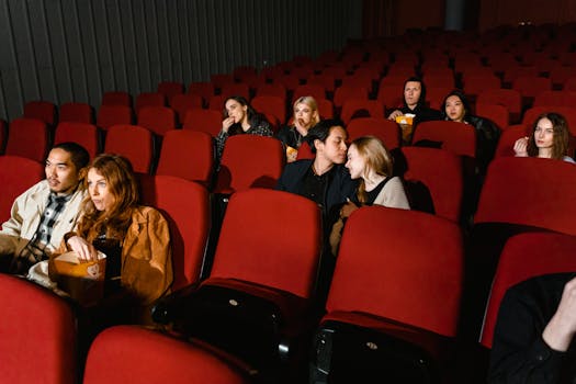 People enjoying a movie in a cozy cinema, capturing real and candid moments.