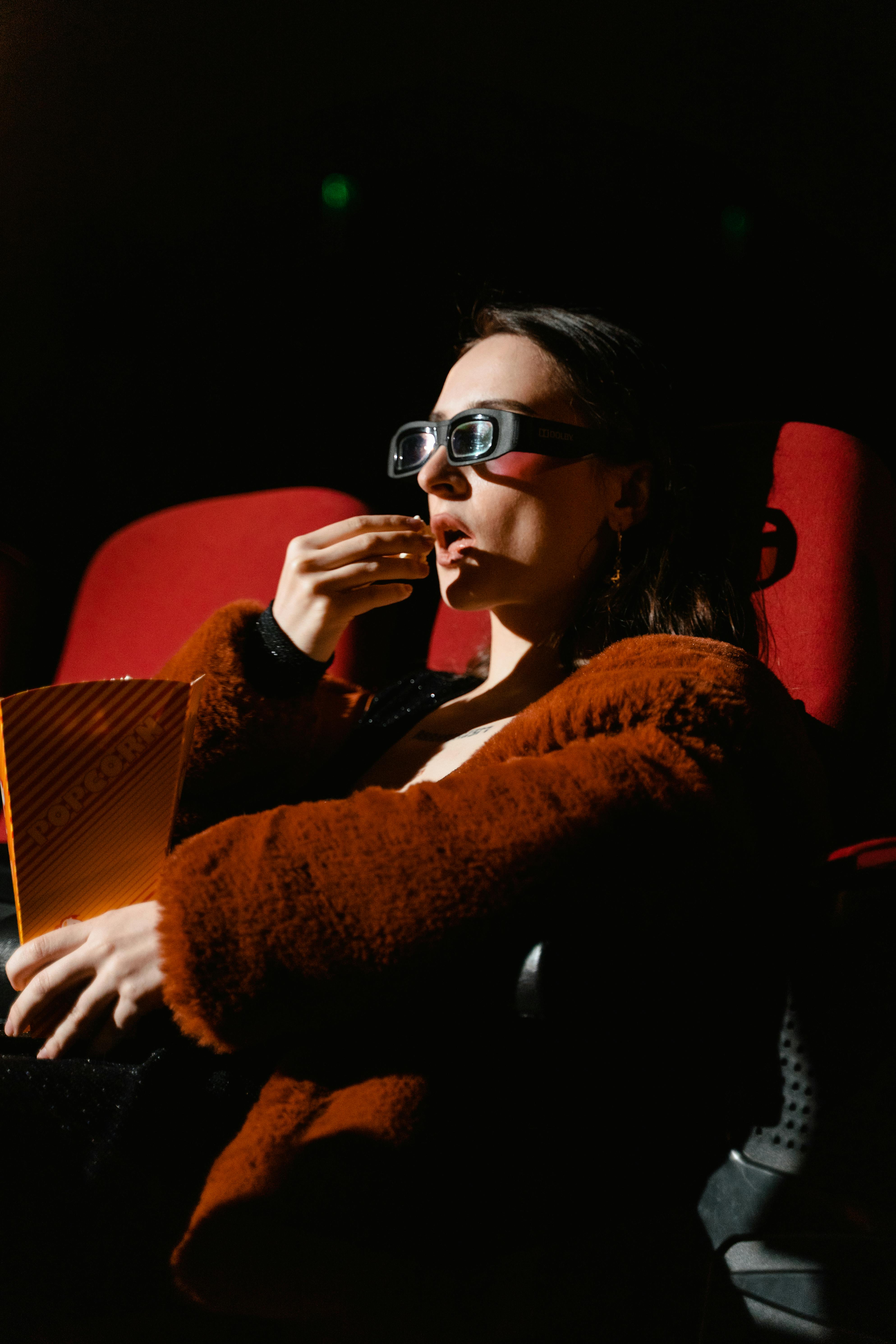 Film projector in a theater symbolizing the blockbuster movie experience