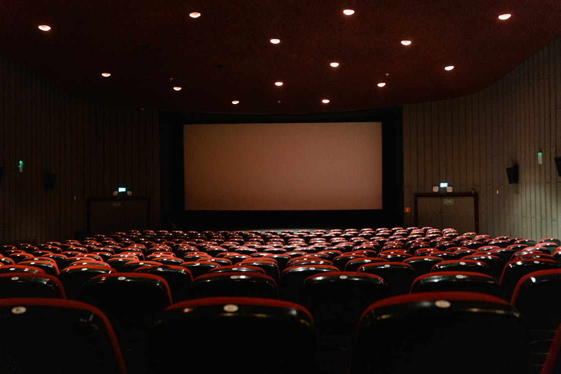 Large Cinema Screen and Empty Chairs