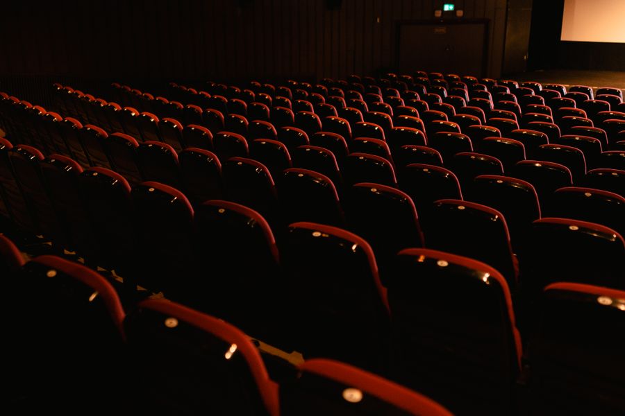 Rows of empty red cinema seats — photo by Tima Miroshnichenko on Pexels