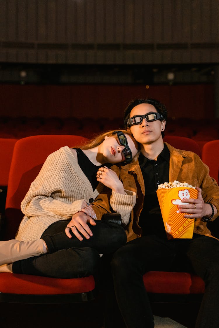 
A Couple Watching A Movie In A Cinema