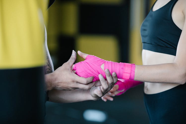 Hands With Pink Wrist Wrap