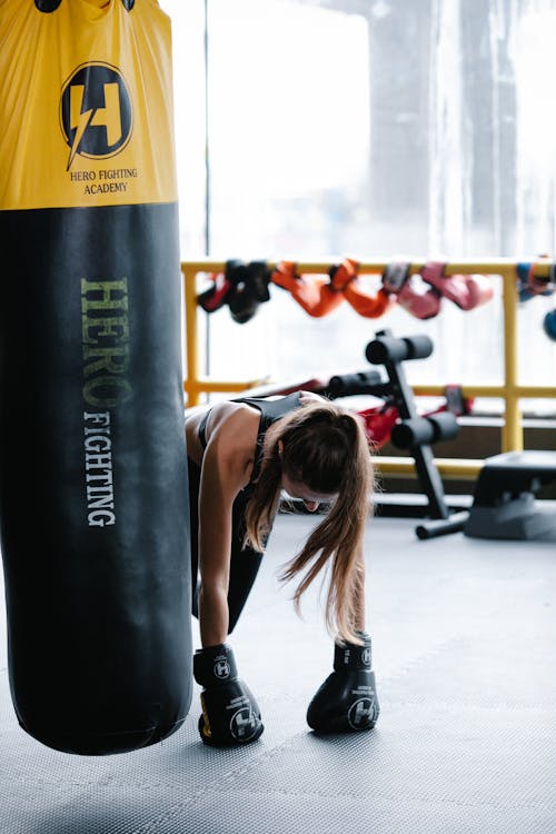 Free Unrecognizable woman pushing up during boxing workout Stock Photo