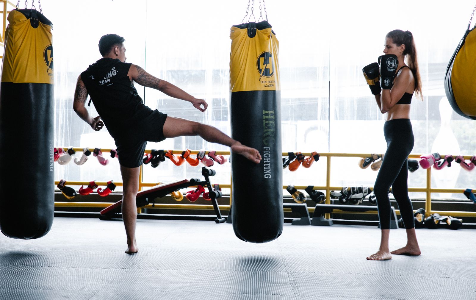 Boxer wrapping hands before training with focus on thumb and wrist support