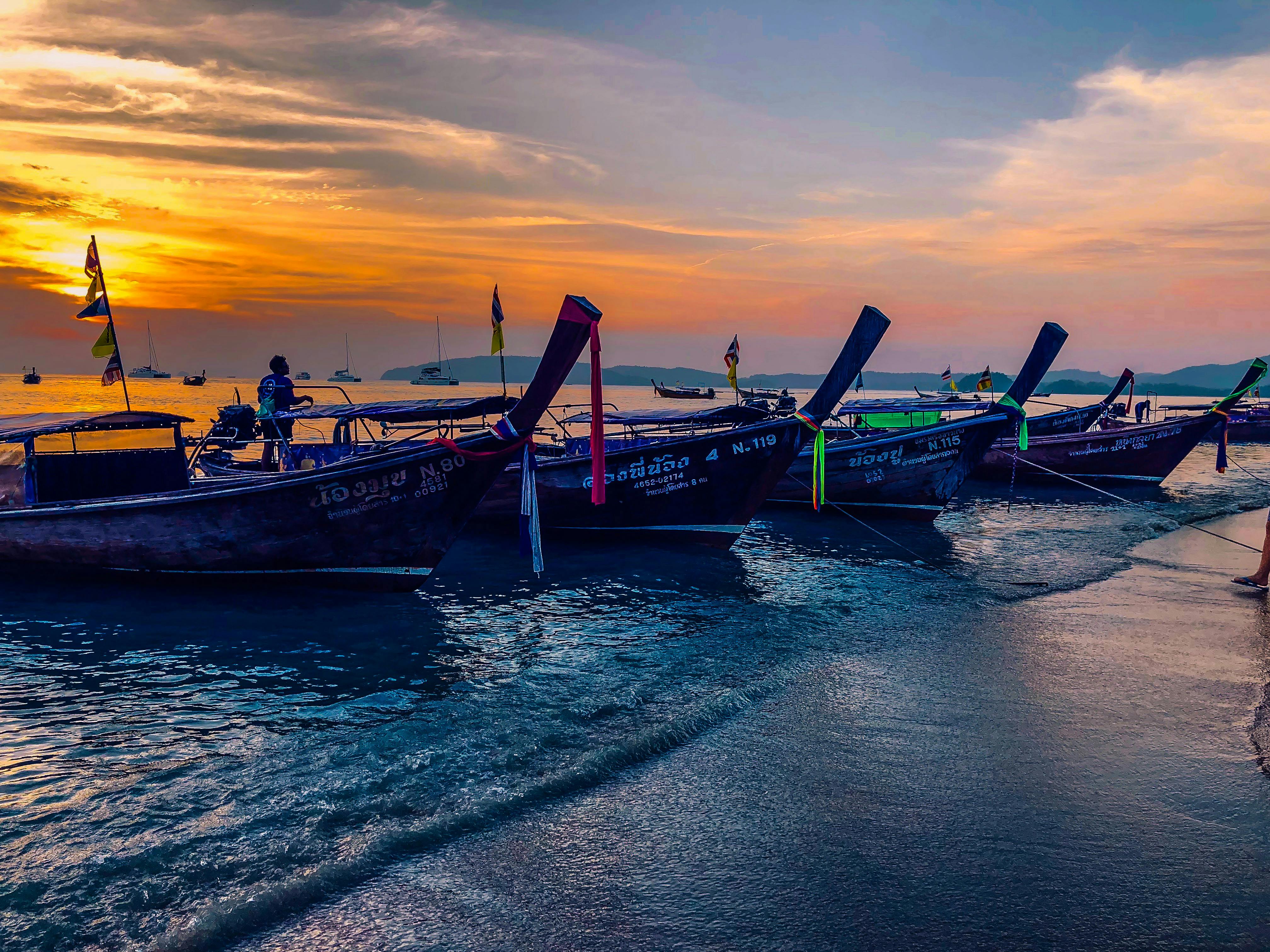 Man mixing a supplement drink in a shaker bottle at the gym