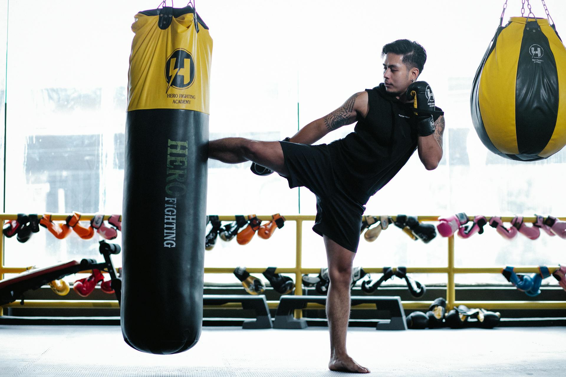 Boxer practicing attack in gym