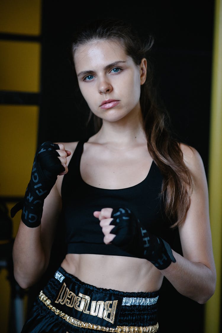 Female Fighter Standing With Hands Folded