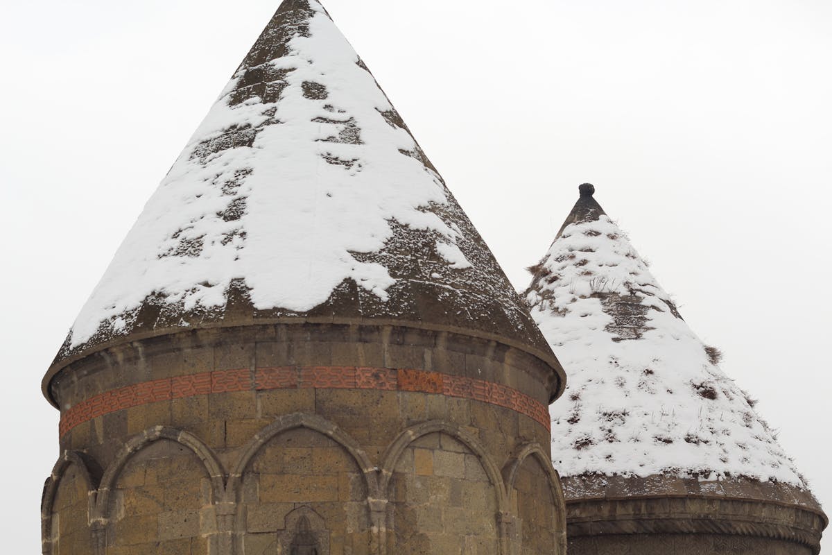 Group of sports fans watching a game together with phones in hand