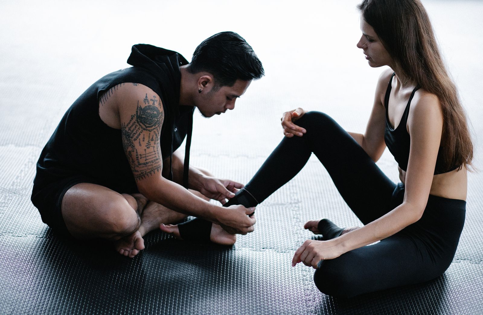 Person stretching their knee outdoors before an active walk