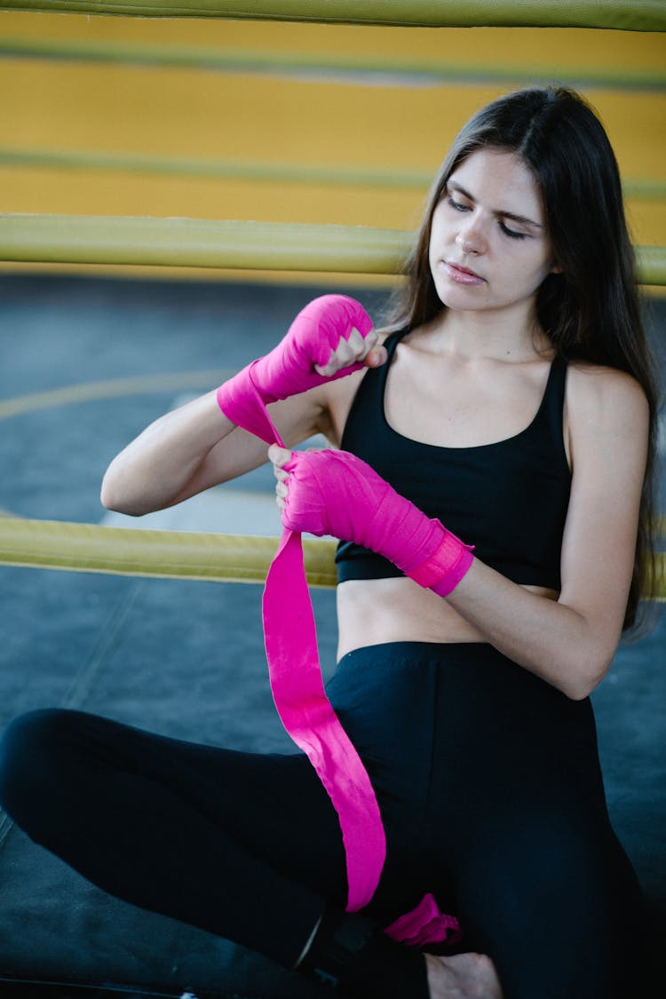 Female Boxer Wrapping Her Hands