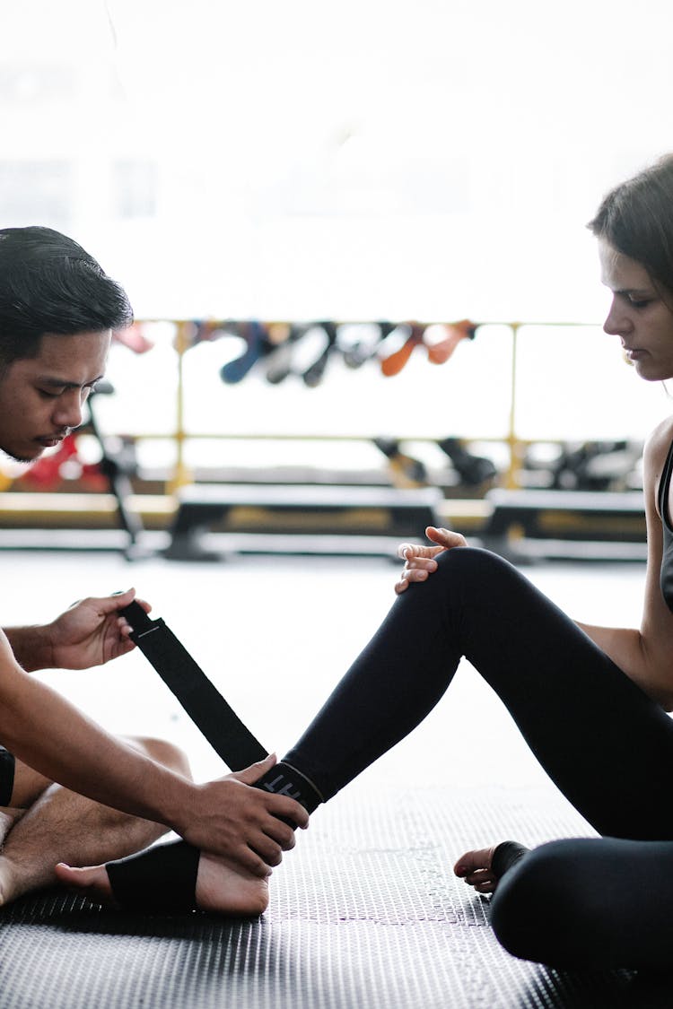 Kickboxer Putting Foot Wraps On 