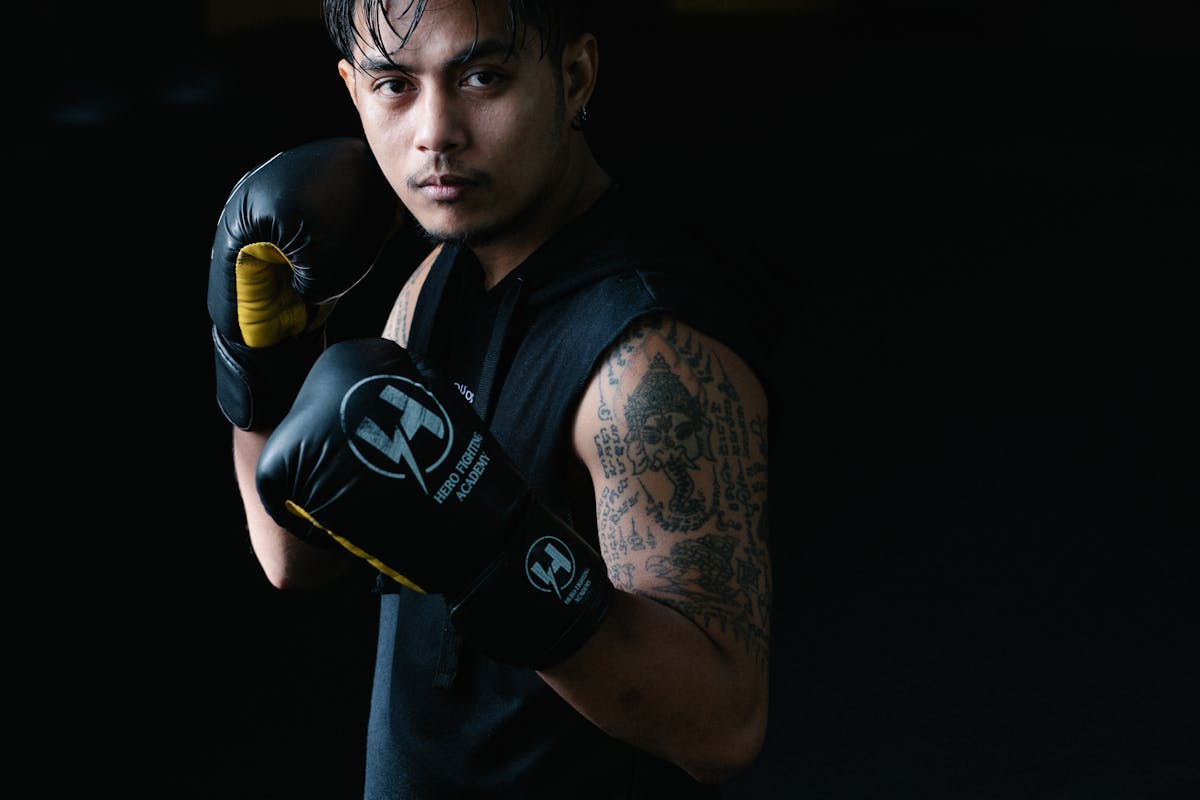 Person lifting weights in a gym representing body recomposition