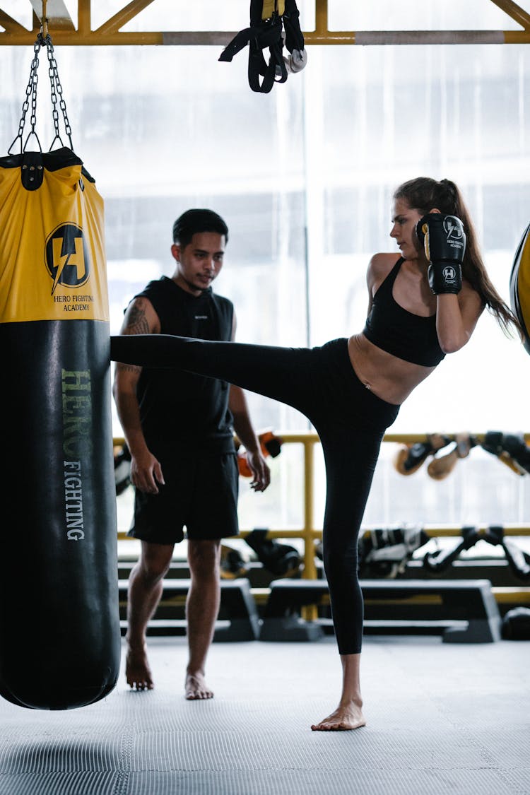 Woman Kicking The Heavy Bag 