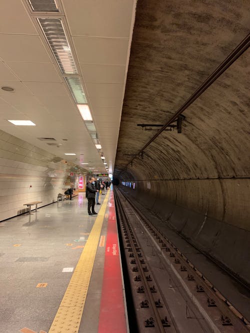 Symmetrical Shot of a Subway Platform and Railway 