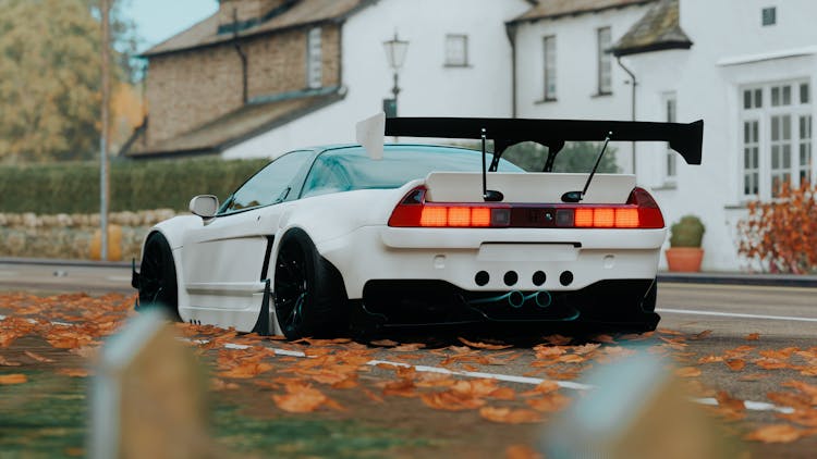 White Honda Car On The Road