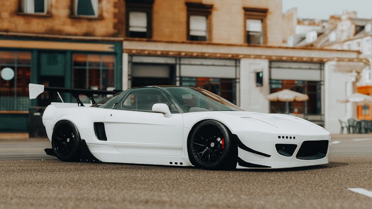 White Honda Car Parked On Road