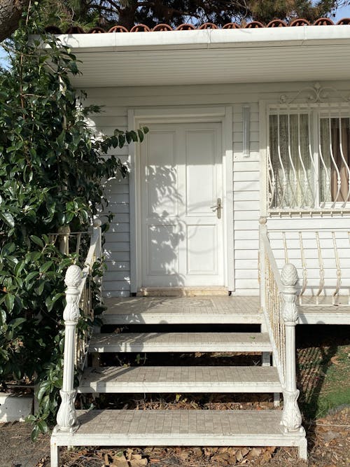 Stairs Beside White Door 