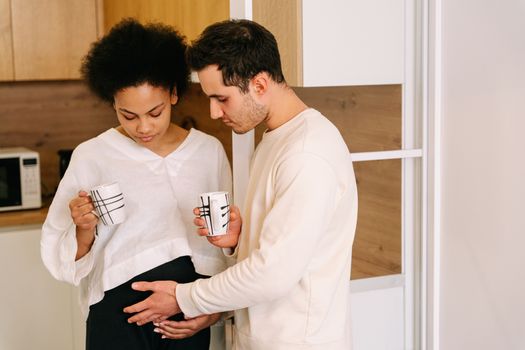 Man Touching the Belly of a Pregnant Woman