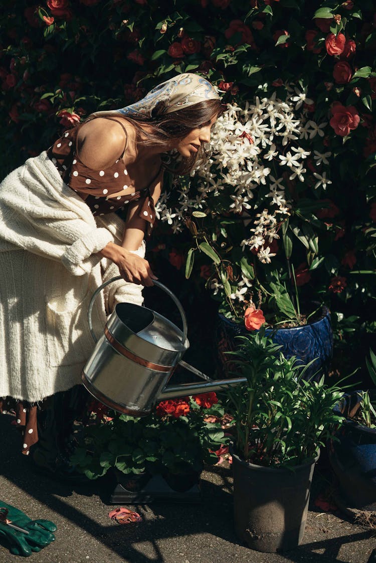 A Woman Watering Plants