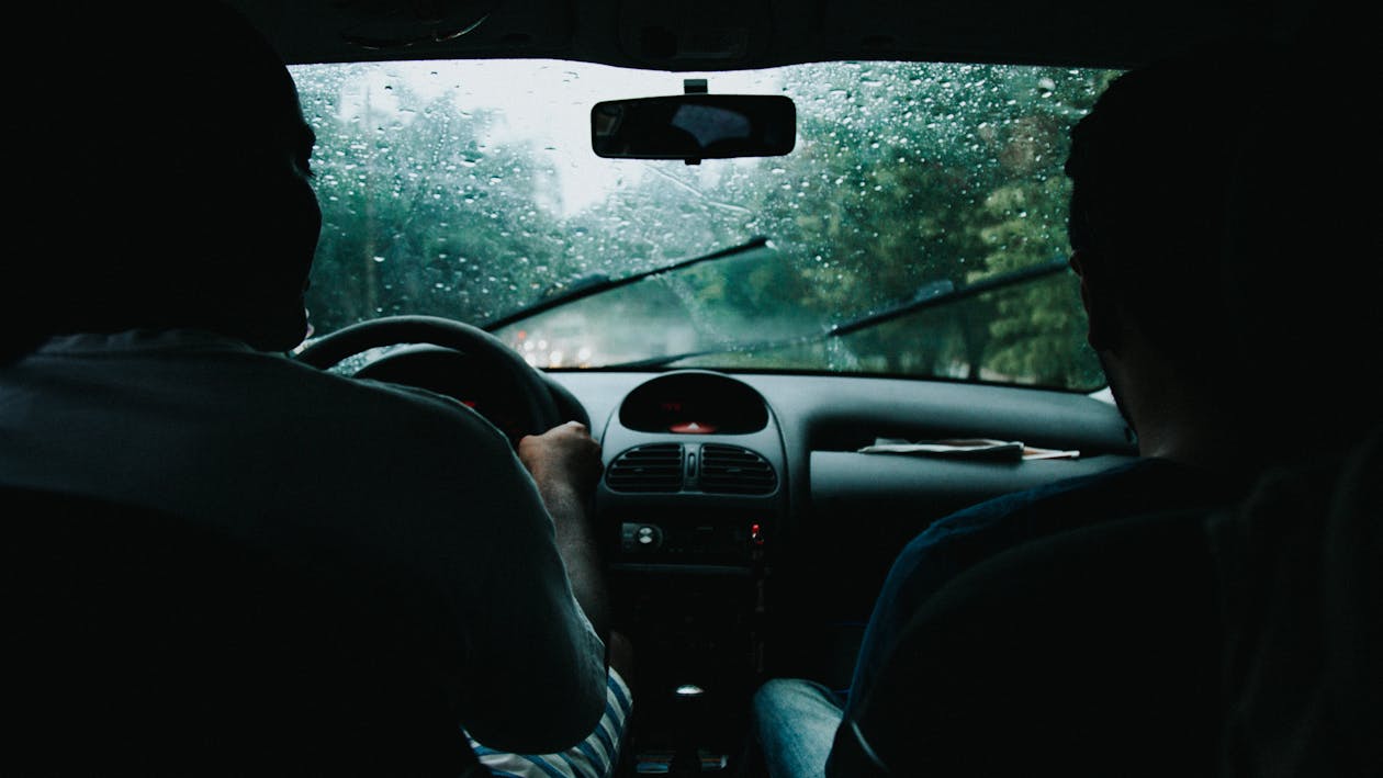 Men sitting in a car