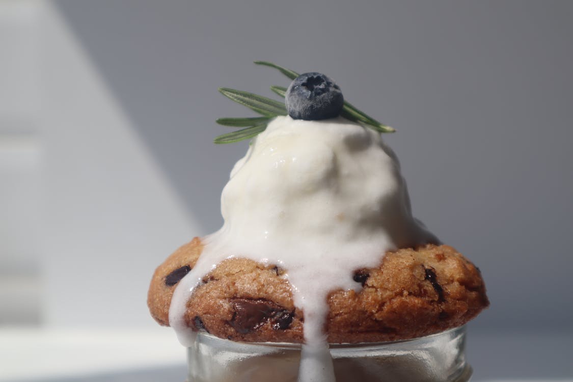 Vanilla Ice Cream Melting on Top of a Cookie