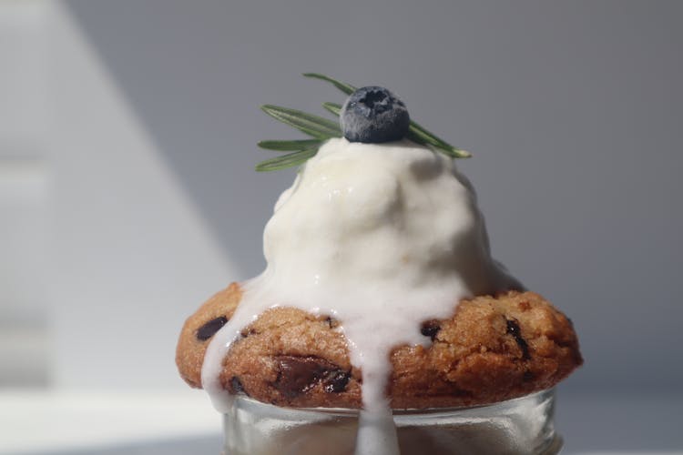 Vanilla Ice Cream Melting On Top Of A Cookie