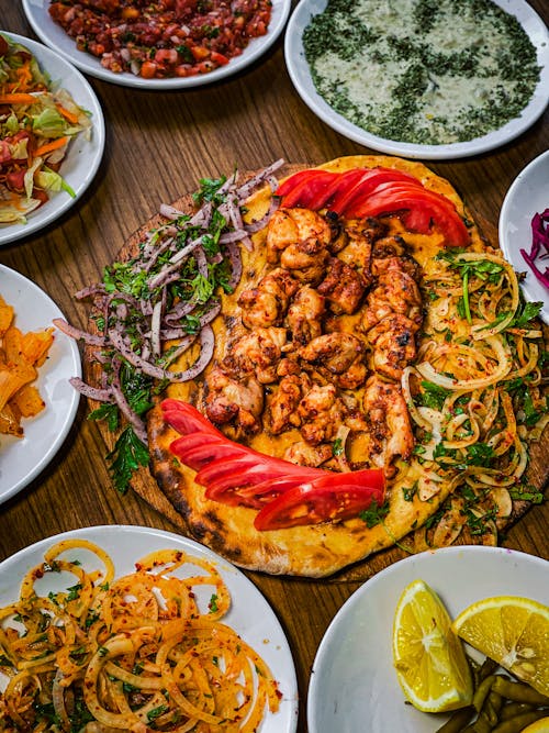 Variety of Cooked Food on Wooden Table